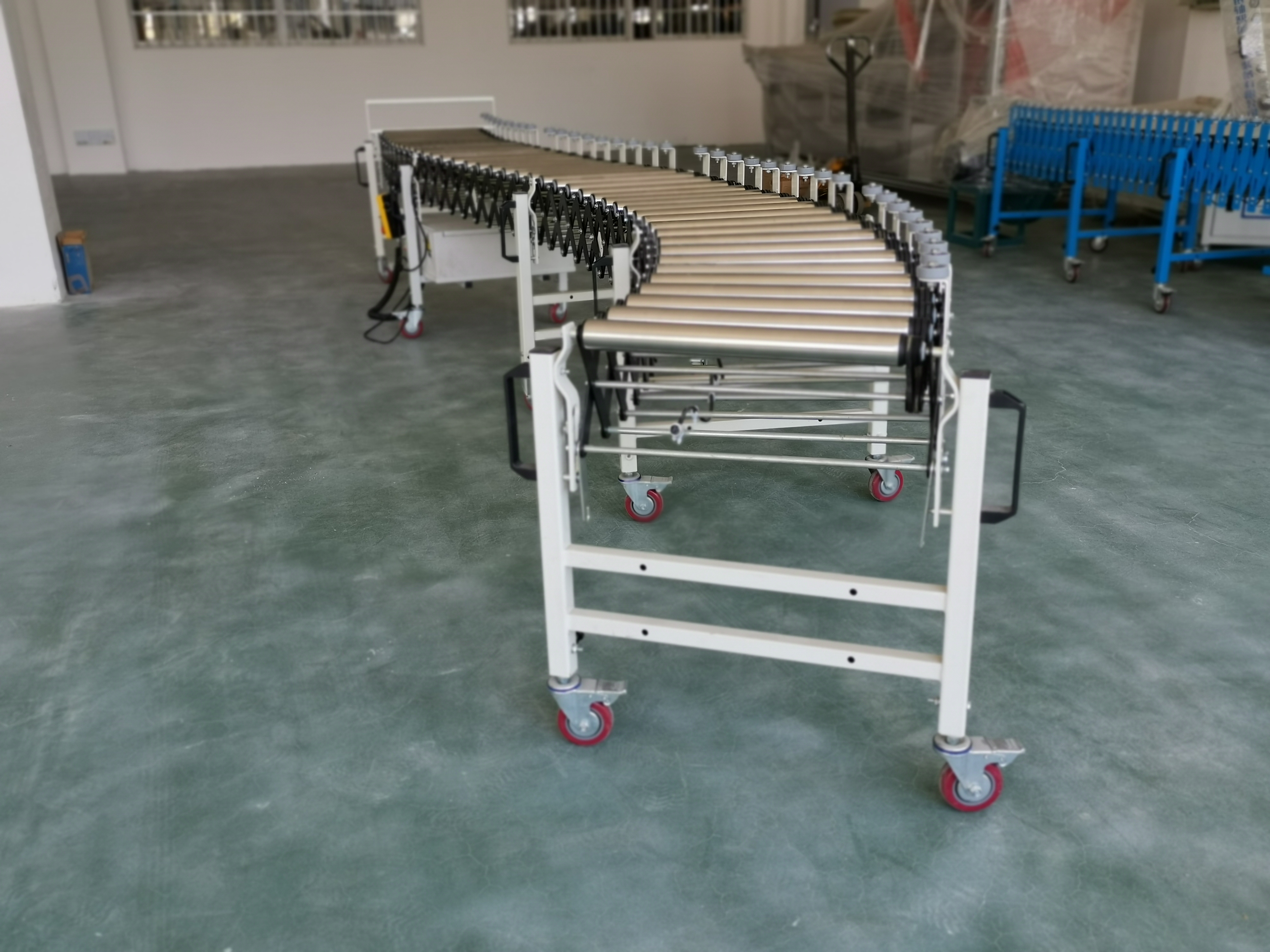 transportador de rodillos flexible con guardolvo